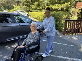 IMG_0073 Caregiver with elderly adult in a wheelchair
